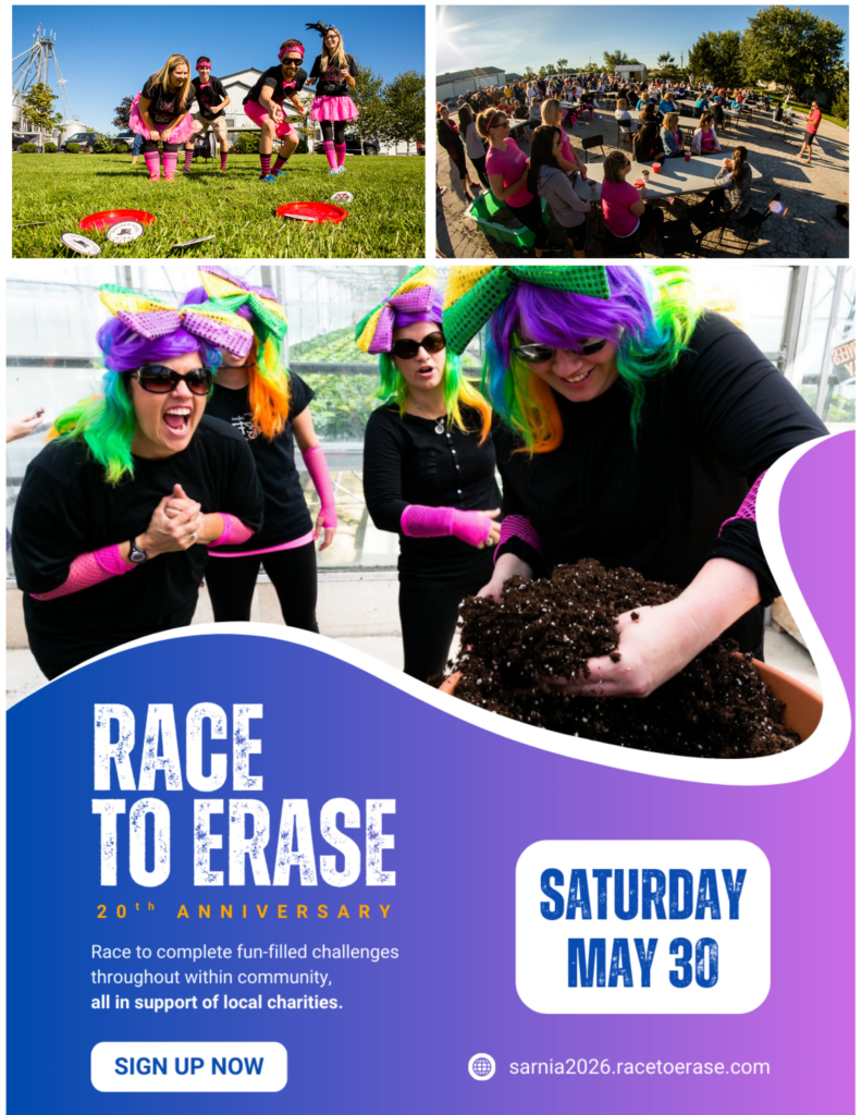 Poster promoting the Race to Erase 20th Anniversary event. Features participants dressed in bright wigs and costumes completing fun outdoor challenges, including team games and gardening activities. Event takes place Saturday, May 30. Text invites participants to race through community-based challenges in support of local charities. Includes website link sarnia2026.racetoerase.com for registration.